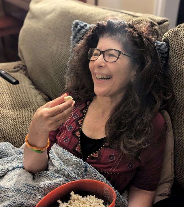 Marianne Sarcich enjoys her favorite snack: popcorn