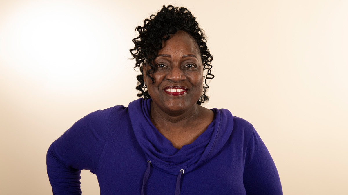 Woman smiling with her hand on her hip