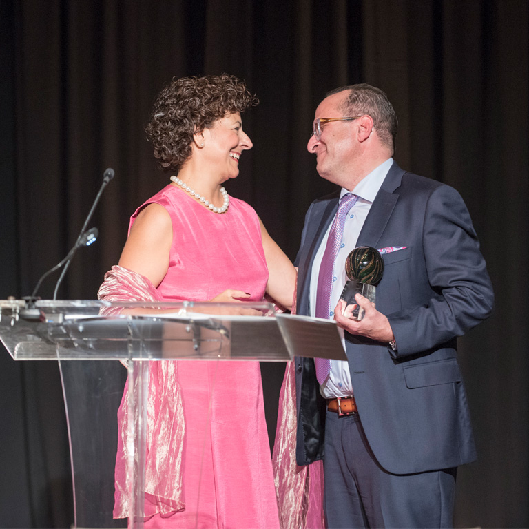 Greg Garber on stage receiving the Founder's award at the Butterfly Ball.