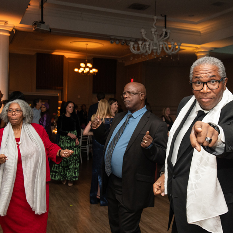 Nancy Herard-Marshall's family dancing on the dance floor at the Butterfly Ball.