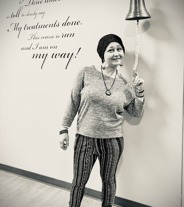 Jenna Antonelli happily rings the bell at a cancer center.