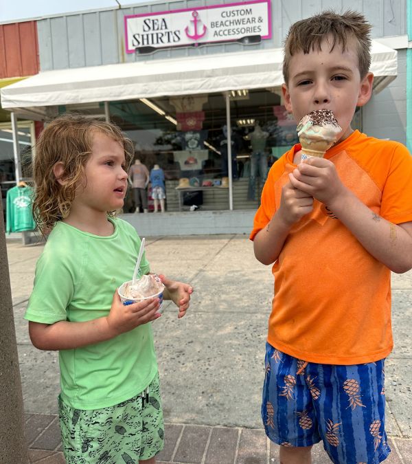 Shannon Gottesman's two young boys eat an ice cream cone on the boardwalk.