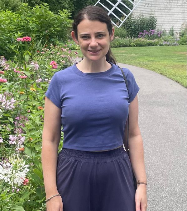 Margalit Tepper walks down a pretty garden path full of wildflowers.