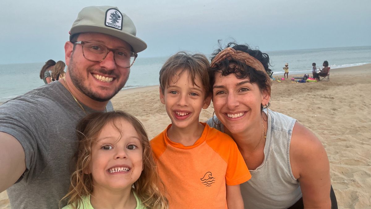 Shannon Gottesman takes a moment for gratitude as she stands on the beach with her husband and two young sons.