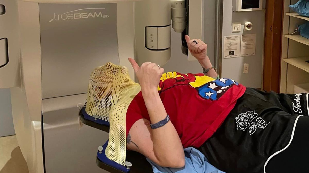 Julie Rock lies on the radiation table.