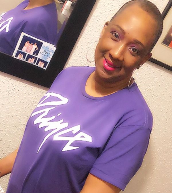 Stephani St. Cyr rocks a purple Prince t-shirt.