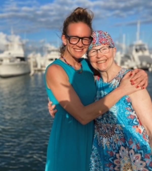 The love between Maura Roby and her daughter Katie is evident in their hug and enormous smiles in this waterfront picture.