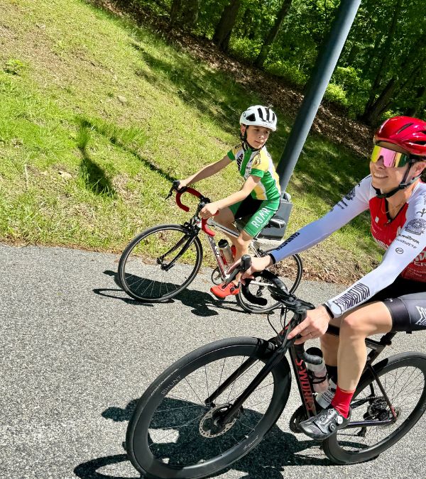 Lisa Csensits and her son cycle on a sunny day like they're training to compete.