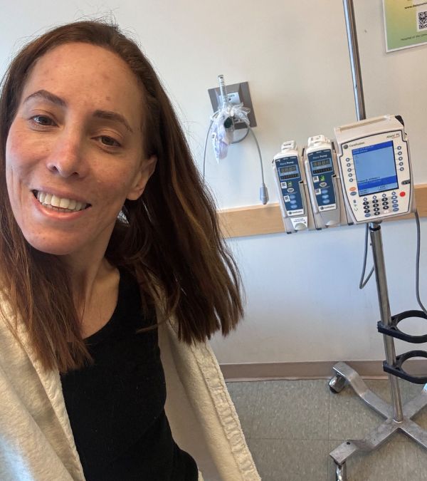 Marisa Berman takes a selfie before chemo, looking confident as she is smiling.