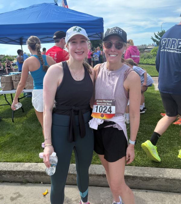 Marisa Berman and her friend share happy smiles after a competitive run.