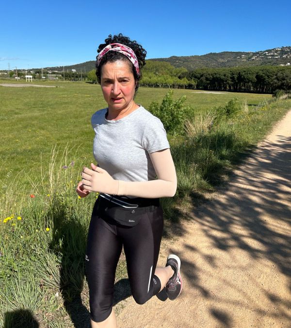 Virginia de Oliveira Marques runs down a gorgeous green landscape.