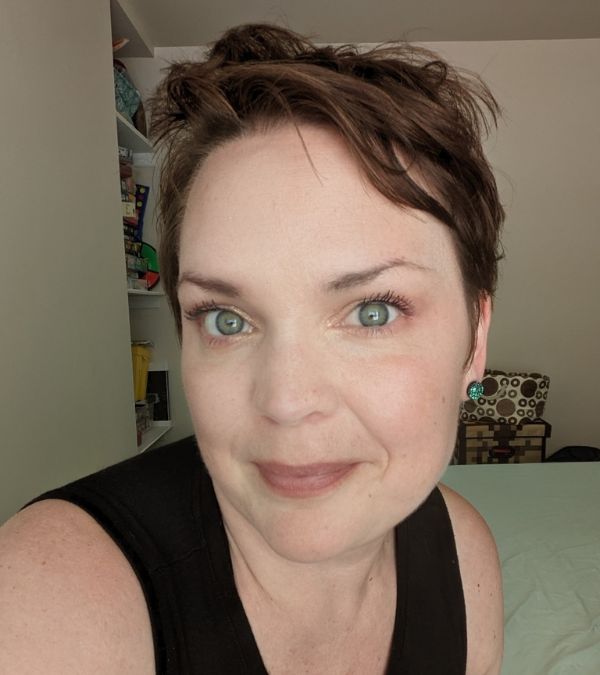 Charlotte Safrit shows off a pixie cut.