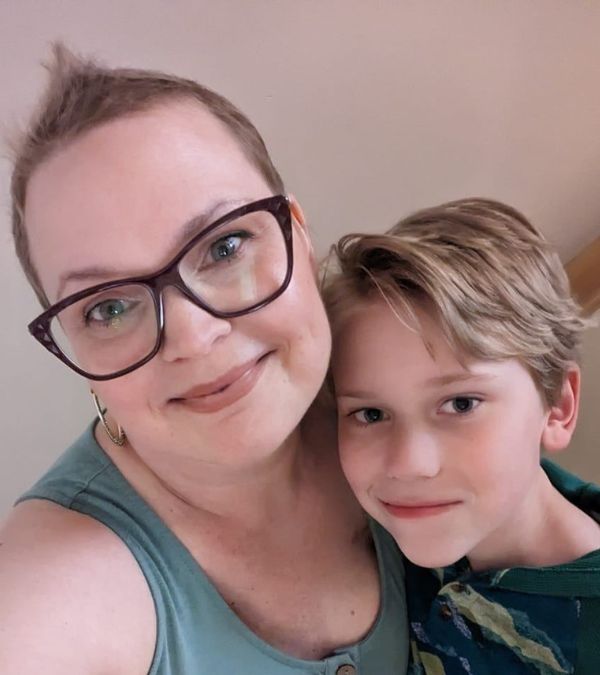 Three months after chemo, Charlotte's hair is starting to come back in, as she demonstrates with her son by her side.