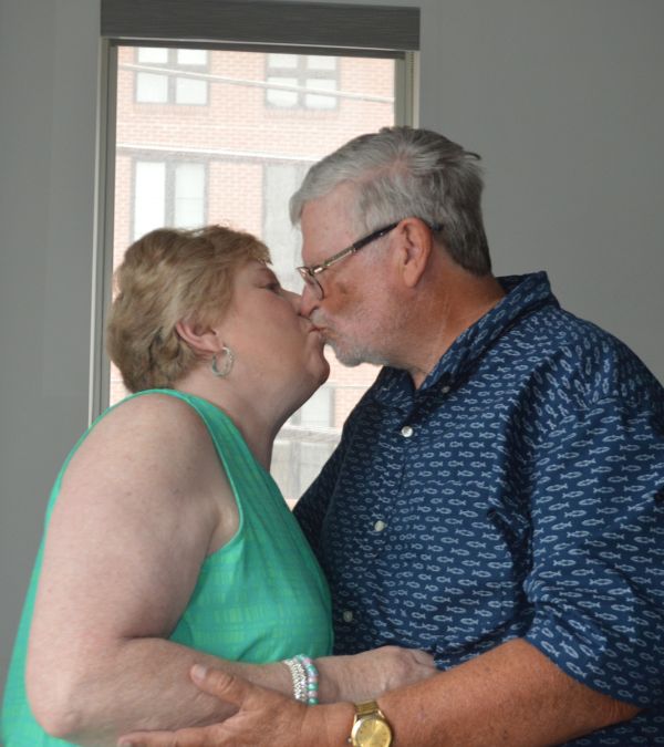 Jeanmarie Mason and her husband Don happily share a kiss.