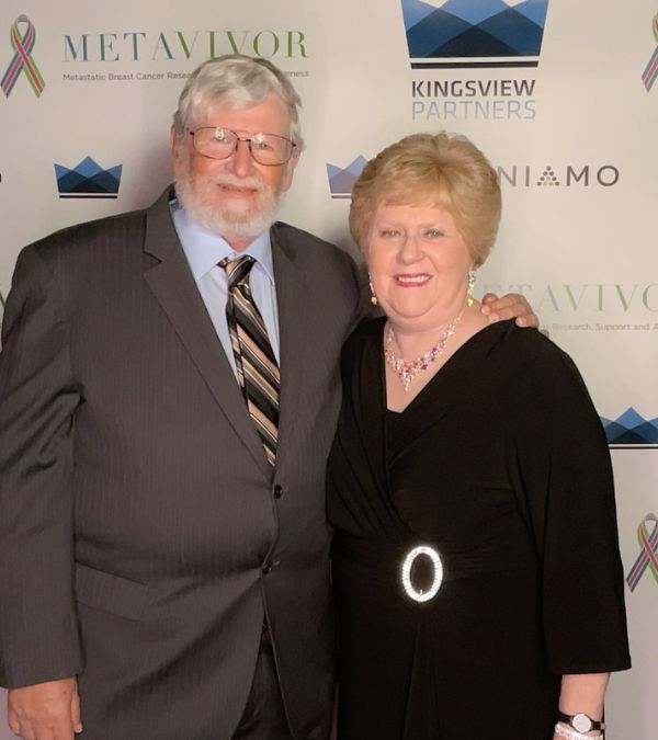 Jeanmarie Mason and her husband Don are elegantly dressed in a dress and suit at an MBC event.