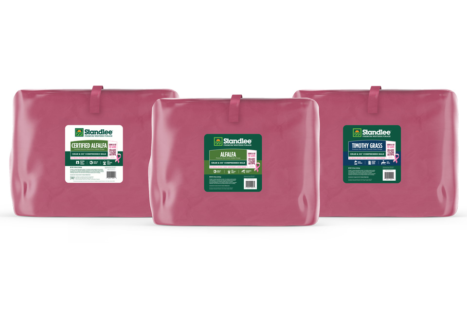 3 pink bales of different kinds of hay