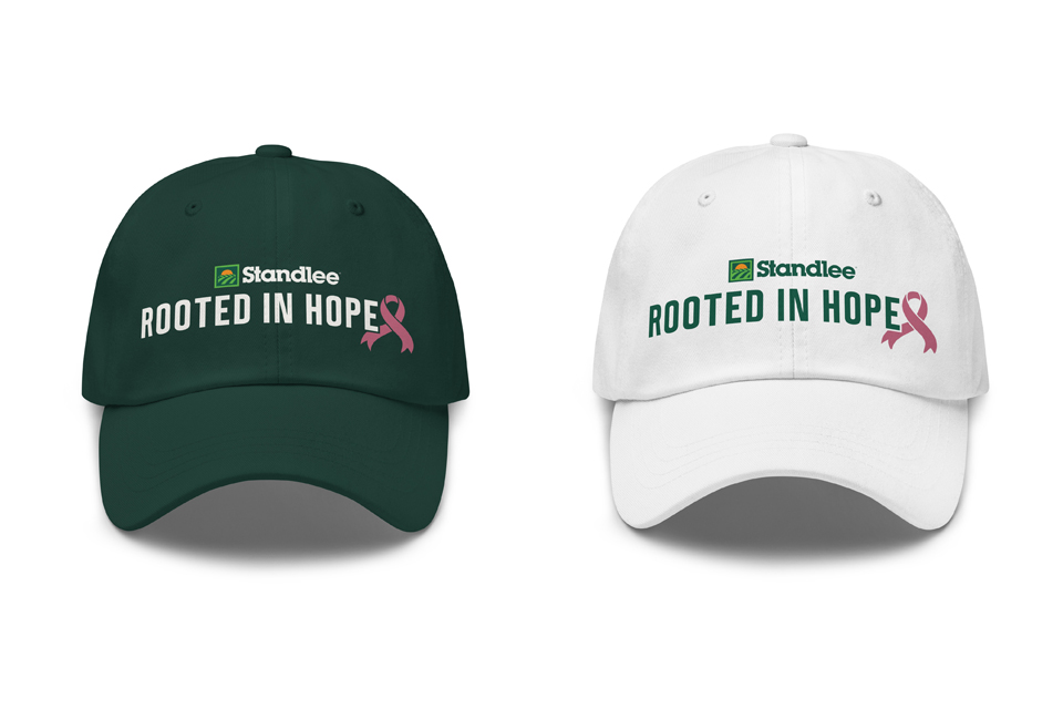 A green hat and a white hat that both say 