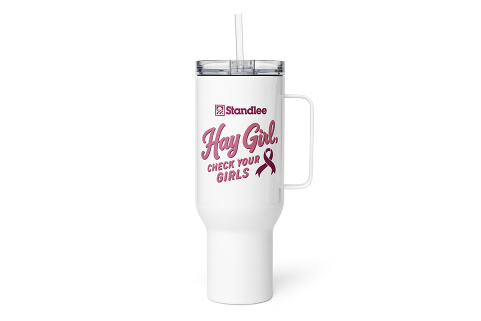 A white tumbler that reads, 