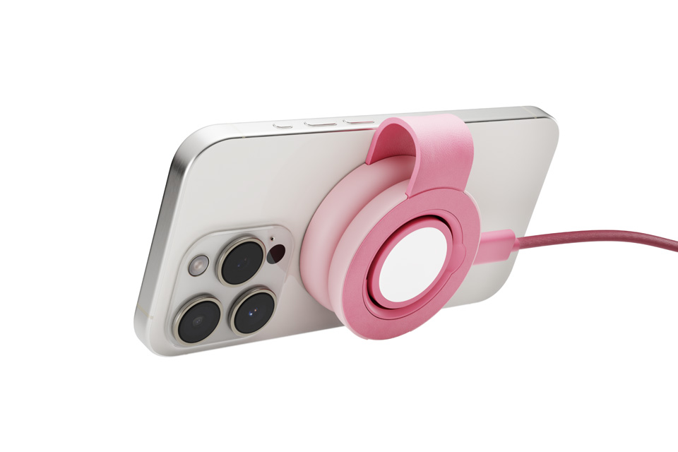 A white iPhone with the Pink charger on the back of the phone