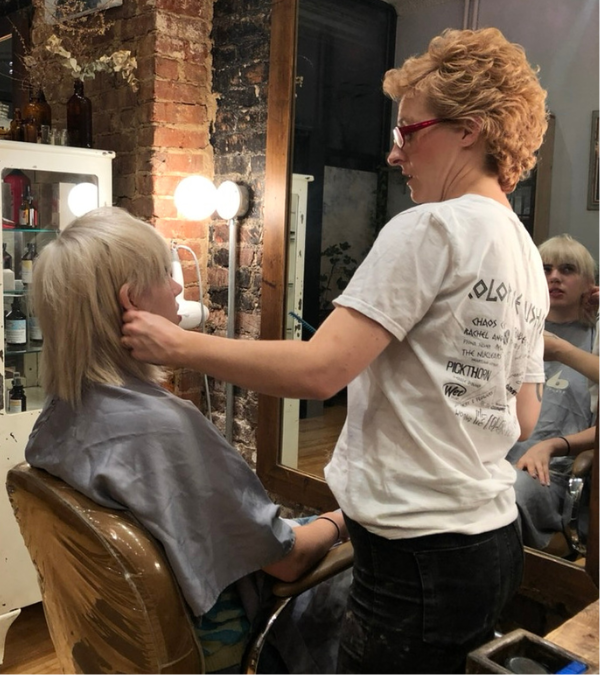 Chelsey styling someone's hair