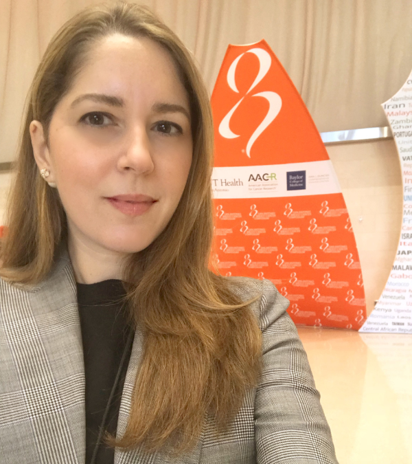 Caroline taking a selfie at a conference