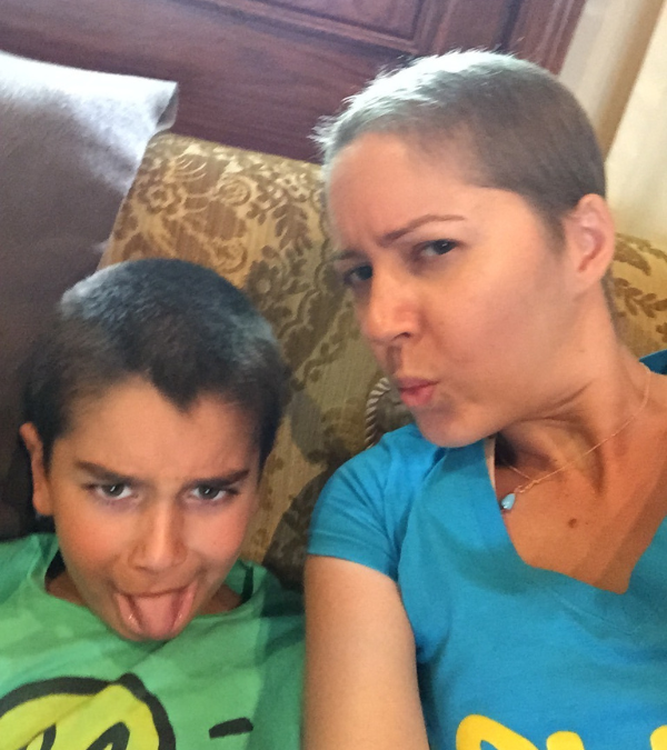 Caroline and her nephew sticking their tongues out