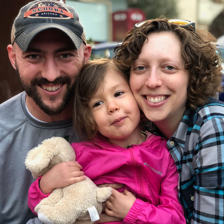 Rebecca Stemplewicz with her husband and their daughter.