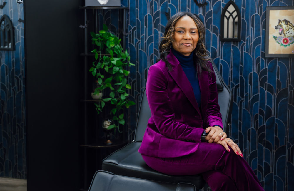 Seated woman tells her story of post-mastectomy tattoo after breast cancer.