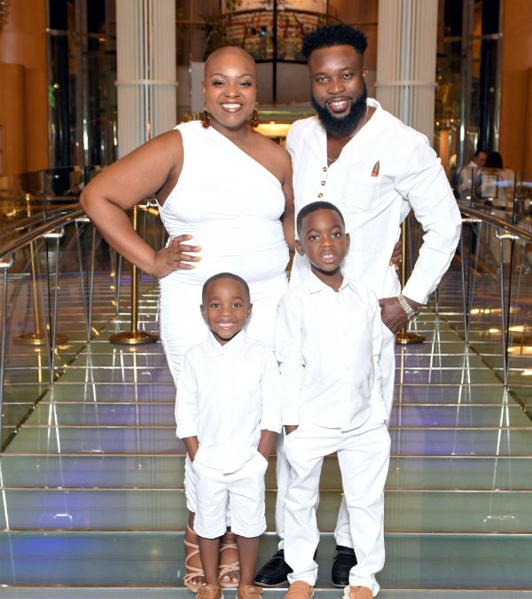 Jonise Louis and her family are looking very stylish in fashionable white outfits in a hotel lobby.