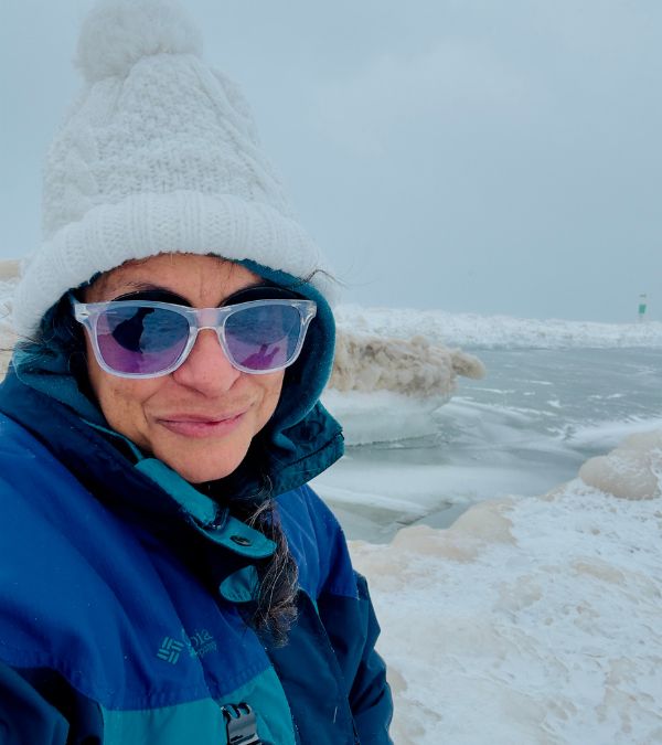 Tiernnee' Jefferis is bundled up in a white, snowy landscape.