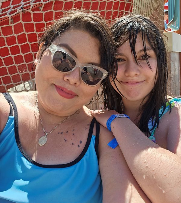 Deb Ontiveros and her daughter lounge by the pool.