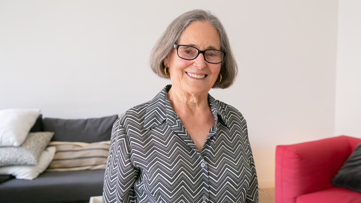 An older white woman smiling