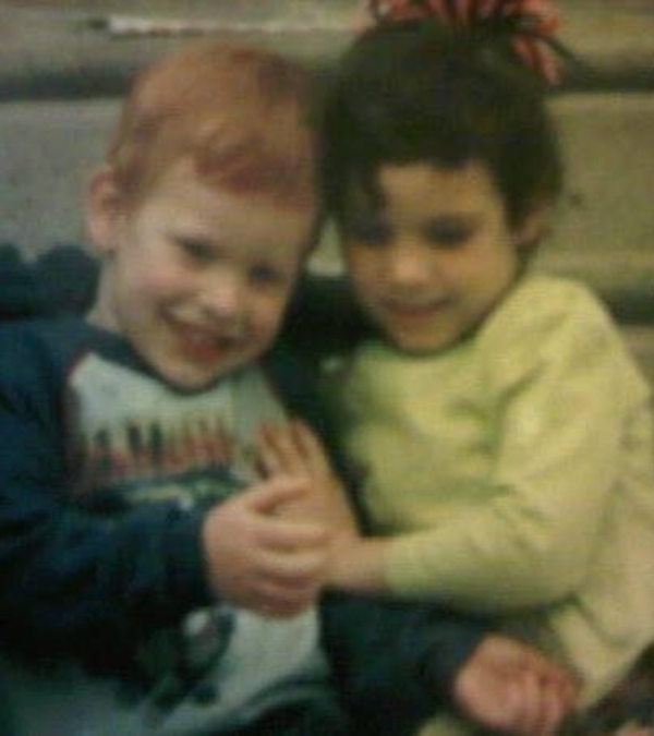 Dave Bohannon and his cousin as young children, cuddling close.