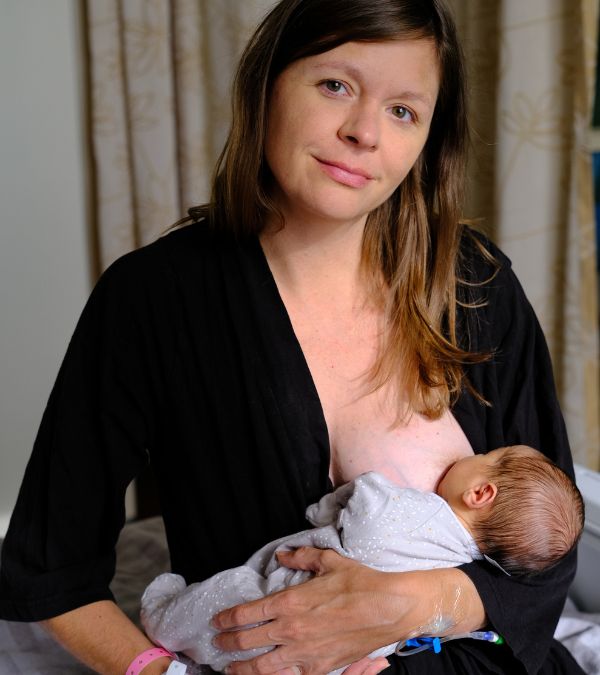 Kim Quick breastfeeds her newborn daughter, 3 months after her mastectomy.