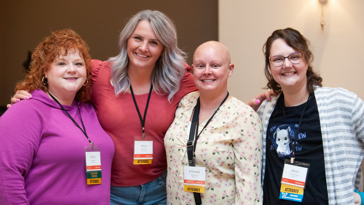Four white woman smiling at the MBC conference